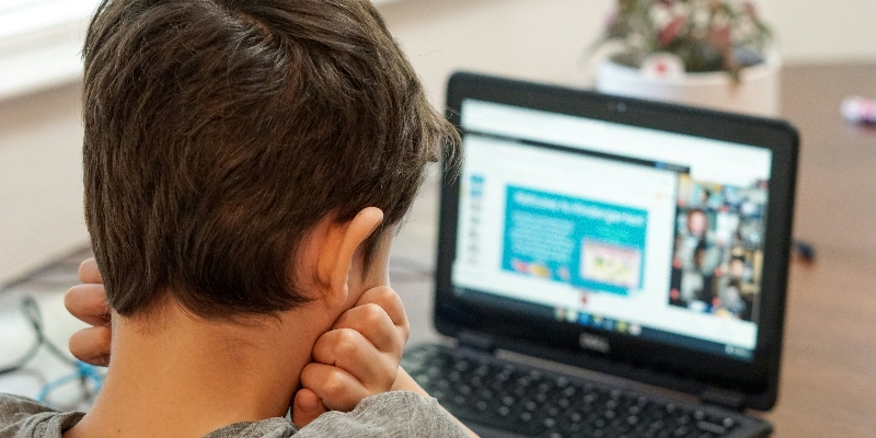 Boy looking at laptop screen t