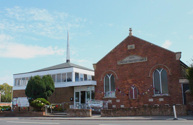 Longfleet Baptist Church outside of church building, with bunting as part of the fete