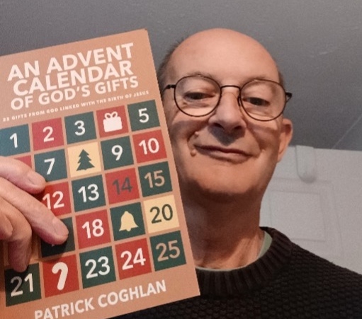 Close up of Patrick Coghlan holding his new book 