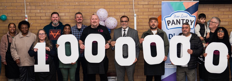 Your Local Partry supporters hold large numbers to show the network receiving its one millionth visit