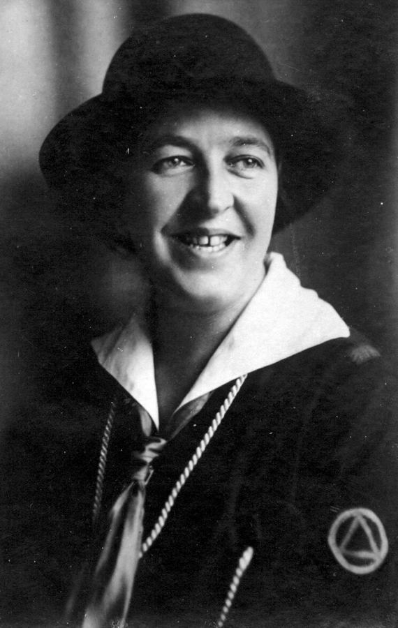 Black and white photo of a young Corrie Ten Boom, smiling