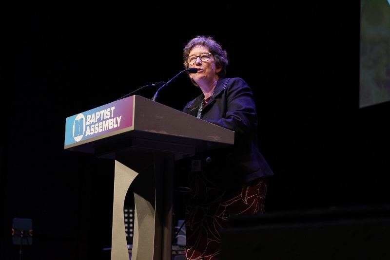 Helen Paynter speaking at a podium at the Baptist Assembly