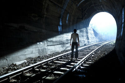 Man standing in tunnel400