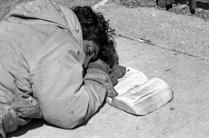 Homeless man with Bible